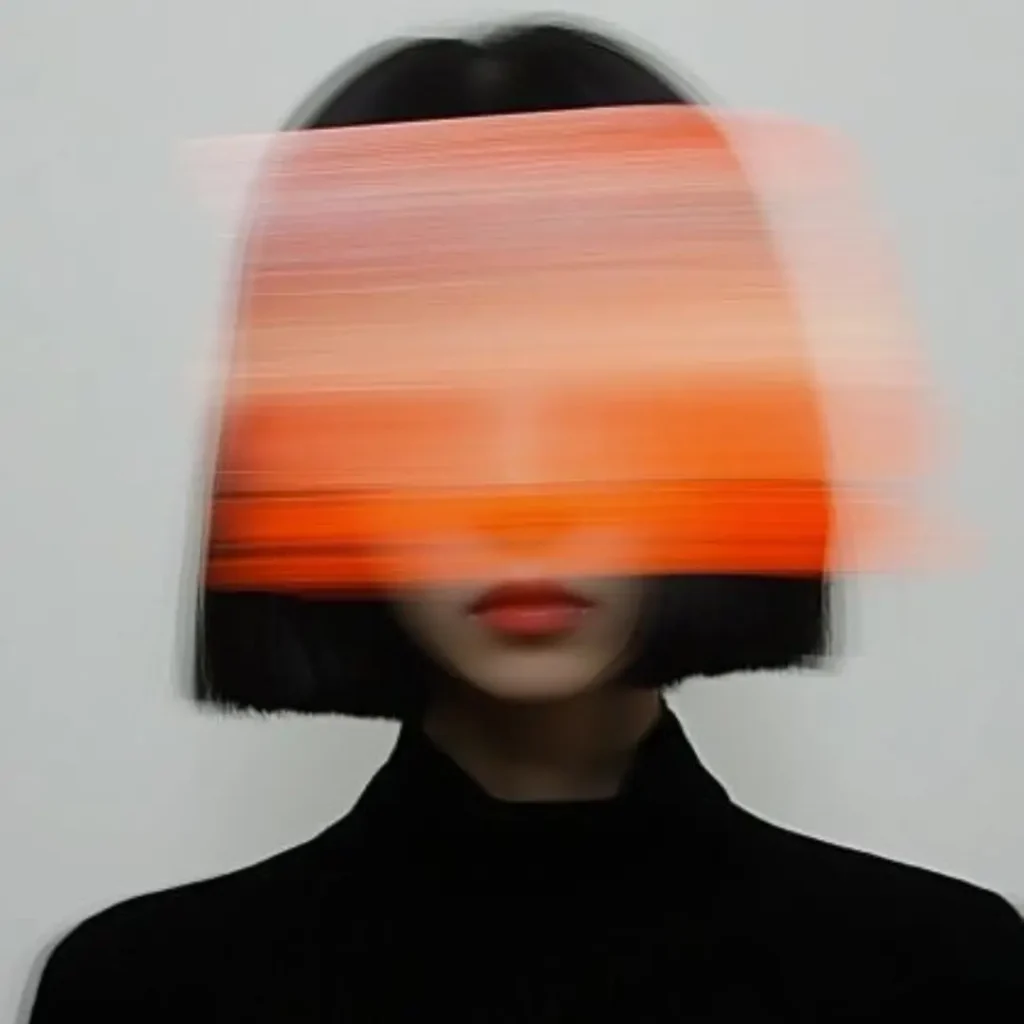 Artistic, motion-blurred black bob and orange color block effect, used as a modern header image for the indian ethnic collection online blog.